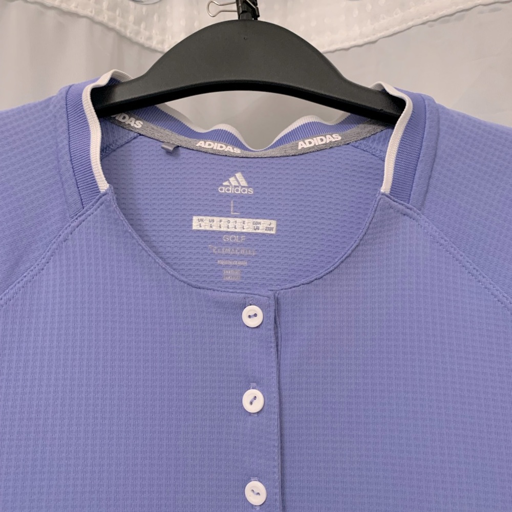 Adidas lilac short sleeved shirt for the course, the courts, or just casual.